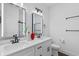 Bright bathroom featuring double sinks, large mirrors, and modern fixtures at 173 Brush Creek Ct, Stockbridge, GA 30281