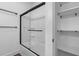 Bathroom features a shower-tub with a sliding glass door and a closet at 173 Brush Creek Ct, Stockbridge, GA 30281