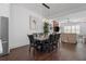 Elegant dining area featuring a modern table setting, view of the entertainment area, and cozy living space at 173 Brush Creek Ct, Stockbridge, GA 30281