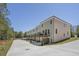 Attractive townhome showcasing a balcony and garage, framed by trees at 173 Brush Creek Ct, Stockbridge, GA 30281