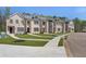Beautiful townhome exterior featuring a well-manicured lawn and inviting entrances at 173 Brush Creek Ct, Stockbridge, GA 30281