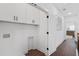 Well-lit laundry area with cabinets and room for storage and organization at 173 Brush Creek Ct, Stockbridge, GA 30281