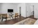 Cozy sitting room with TV, perfect for relaxation and entertainment on the upper floor at 173 Brush Creek Ct, Stockbridge, GA 30281