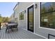 Spacious outdoor deck with table set, featuring grey composite material and views of the backyard at 177 Brush Creek Ct, Stockbridge, GA 30218