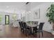 Elegant dining room with a large table, seating for eight, and views into the stylish kitchen at 177 Brush Creek Ct, Stockbridge, GA 30218