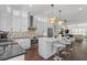 Modern kitchen with white cabinetry, stainless steel appliances, and a breakfast bar for casual dining at 177 Brush Creek Ct, Stockbridge, GA 30218