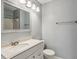 Cozy bathroom with a vanity, toilet, and shower with tiled walls and neutral wall color at 244 13Th Ne St # 302, Atlanta, GA 30309