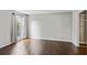 Bright bedroom features hardwood floors, neutral paint, and a large window with curtains at 244 13Th Ne St # 302, Atlanta, GA 30309