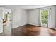 Bedroom with hardwood floors, large window and doorway to living area for seamless flow at 244 13Th Ne St # 302, Atlanta, GA 30309