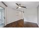 Empty bedroom with hardwood floors, ceiling fan, sliding door, and neutral paint at 244 13Th Ne St # 302, Atlanta, GA 30309