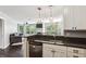 Open kitchen with stainless appliances, granite counters, and view of living room at 244 13Th Ne St # 302, Atlanta, GA 30309