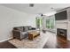 Well-lit living room with comfortable sofa, fireplace, and hardwood floors at 244 13Th Ne St # 302, Atlanta, GA 30309