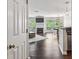 Open-concept living room with fireplace, hardwood floors, and a dining area at 244 13Th Ne St # 302, Atlanta, GA 30309