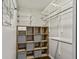 Organized walk-in closet featuring custom shelving and storage solutions to maximize space at 244 13Th Ne St # 302, Atlanta, GA 30309