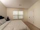 Cozy bedroom with a window, patterned bedding, and minimal decorations at 5715 Radford Loop # 15, Fairburn, GA 30213