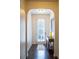 Inviting foyer with hardwood floors, arched doorway, and a console table with decorative accents at 5715 Radford Loop # 15, Fairburn, GA 30213