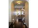 Hallway with dark wood floors leading to the living room and staircase at 5715 Radford Loop # 15, Fairburn, GA 30213