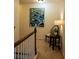 Upstairs hallway with view of railing and decorative table with lamp at 5715 Radford Loop # 15, Fairburn, GA 30213