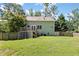 Backyard with green lawn, wooden deck, and partial fence at 98 Little John Way, Douglasville, GA 30134