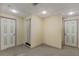 Unfinished basement area featuring painted doors and neutral carpet at 98 Little John Way, Douglasville, GA 30134