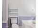 This bathroom includes a sleek white toilet with white shelving and trim detail at 98 Little John Way, Douglasville, GA 30134