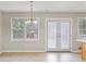 Bright dining area featuring large windows and access to the backyard at 98 Little John Way, Douglasville, GA 30134
