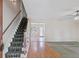Spacious foyer with hardwood floors and a staircase leading to the upper level at 98 Little John Way, Douglasville, GA 30134