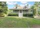 Charming home with a welcoming front porch and well-maintained lawn at 98 Little John Way, Douglasville, GA 30134