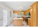 Well-equipped kitchen with an island, gas range, and ample cabinet space at 98 Little John Way, Douglasville, GA 30134