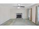 Cozy living room featuring a stone fireplace and ample natural light at 98 Little John Way, Douglasville, GA 30134