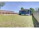 Fenced backyard with ample green space, offering privacy and room for outdoor activities at 1497 Rogers Ave, Atlanta, GA 30310