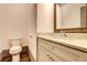 Powder Room featuring a toilet and modern vanity at 1497 Rogers Ave, Atlanta, GA 30310