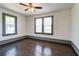 Bedroom with hardwood floors and natural light from two windows at 1497 Rogers Ave, Atlanta, GA 30310