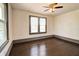 An empty bedroom with dark hardwood floors and a ceiling fan at 1497 Rogers Ave, Atlanta, GA 30310