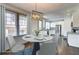 Virtually staged dining room next to the kitchen with a view of the stainless steel appliances at 1497 Rogers Ave, Atlanta, GA 30310