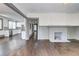 Bright and open living space with a view into the contemporary kitchen and a decorative fireplace at 1497 Rogers Ave, Atlanta, GA 30310