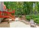 Multi-level backyard with deck, stairs and gravel patio offers a peaceful retreat at 3450 Saddleton Way, Douglasville, GA 30134