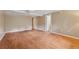 Spacious basement area with wood floors, neutral paint, and multiple doorways at 3450 Saddleton Way, Douglasville, GA 30134