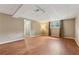 Spacious basement area with wood floors, neutral paint, and a large window for natural light at 3450 Saddleton Way, Douglasville, GA 30134