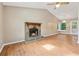 Spacious living room features vaulted ceilings, a stone fireplace, and plenty of natural light at 3450 Saddleton Way, Douglasville, GA 30134