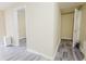 Hallway features attractive gray wood-look flooring and leads to other rooms of the house at 3500 Parkwood Hills Ct, Snellville, GA 30078