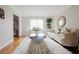 Stylish living room with neutral tones, modern furniture, bright natural light, and hardwood flooring at 3500 Parkwood Hills Ct, Snellville, GA 30078
