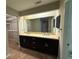 Bathroom with double vanity, large mirror, and walk-in closet at 40 Dunwoody Springs Dr, Atlanta, GA 30328