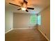 Spacious bedroom featuring hardwood floors and natural light from two windows at 40 Dunwoody Springs Dr, Atlanta, GA 30328