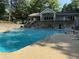 Large community swimming pool with sundeck and multi-level clubhouse at 40 Dunwoody Springs Dr, Atlanta, GA 30328