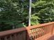 Backyard wooden deck with wooded views and plenty of space for outdoor furniture at 40 Dunwoody Springs Dr, Atlanta, GA 30328