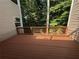 This backyard deck with wooded views is the perfect place to relax or entertain at 40 Dunwoody Springs Dr, Atlanta, GA 30328