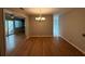 Bright dining room featuring pristine hardwood floors, neutral walls, and modern chandelier at 40 Dunwoody Springs Dr, Atlanta, GA 30328