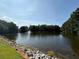 Scenic lake view with a fountain surrounded by lush greenery and trees at 40 Dunwoody Springs Dr, Atlanta, GA 30328