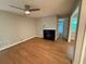 Open-concept living room featuring a fireplace, hardwood floors, and neutral-colored walls at 40 Dunwoody Springs Dr, Atlanta, GA 30328